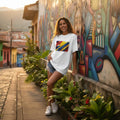Woman standing against a wall in a colorful street. 