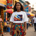 DR Congo Leapards Light. Woman wearing a colorful outfit with a street market in the background