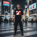 Japan Samurai Red Dark Mode. Person wearing a black t-shirt with a red and white graphic design in a bustling city street at night.