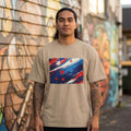 New Zealand Aoteaora Sand. Man with beige shirt standing in front of mural. 