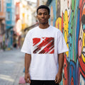 Turkey Crescent Stars Light. Man wearing a white t-shirt with a red and brown abstract design in an urban setting with colorful graffiti.